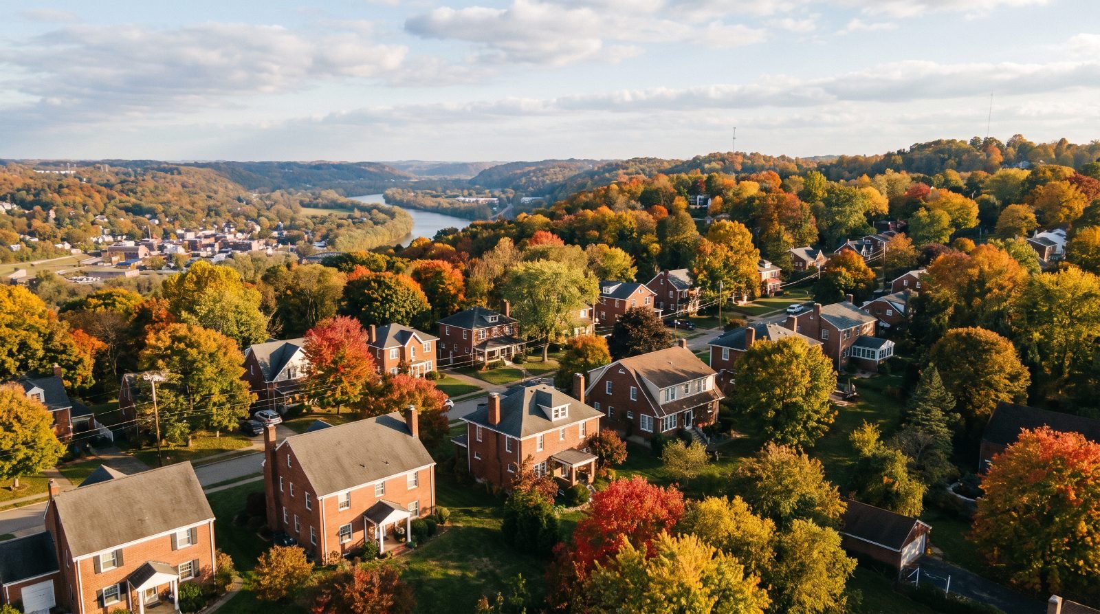 Aerial view of a hilly Pittsburgh-area residential neighbourhood with chimneys on every roof